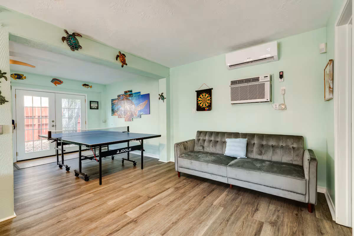 Game room with ping-pong table and lounge seating